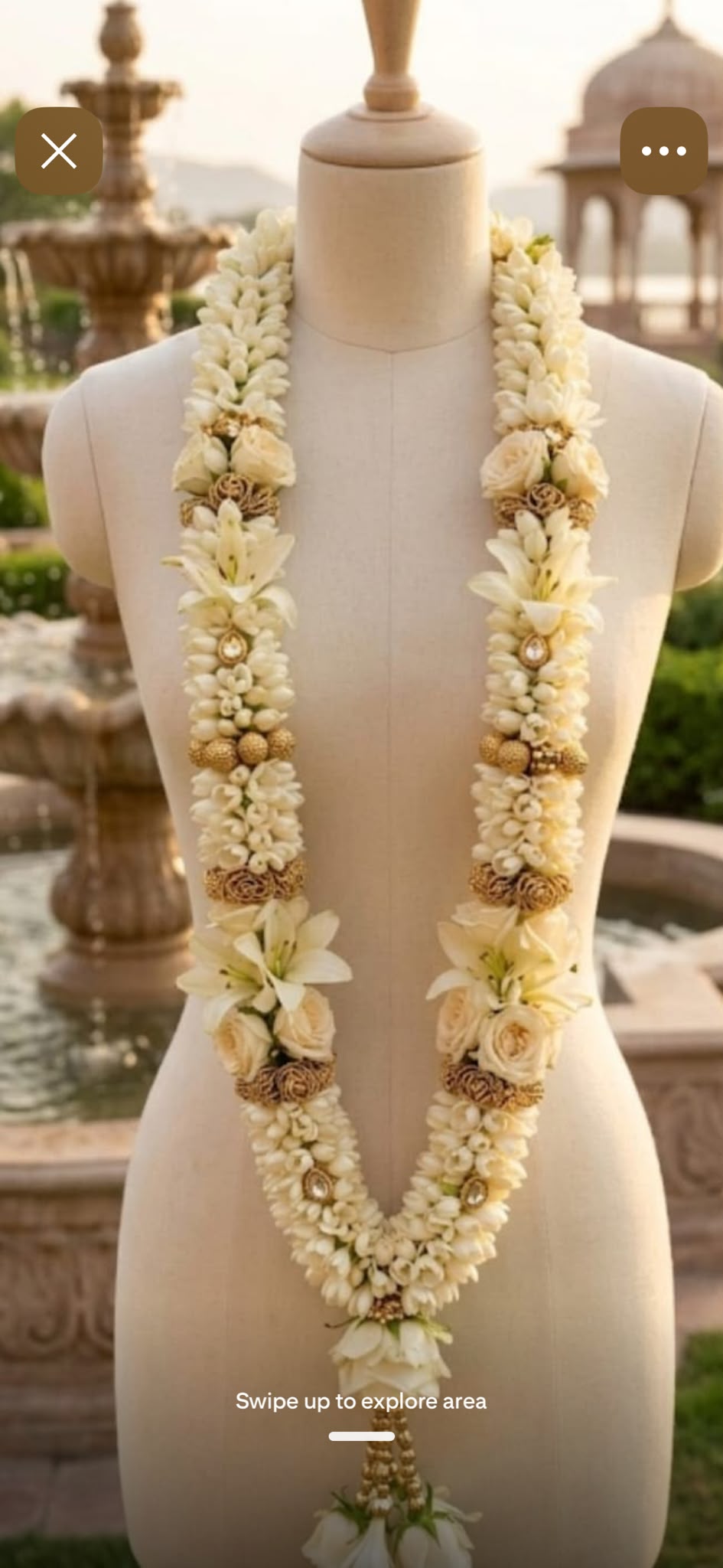 White lilies and white spray roses garland on a mannequin