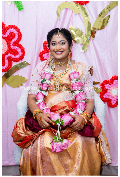 Pink flowers and baby's breath garland