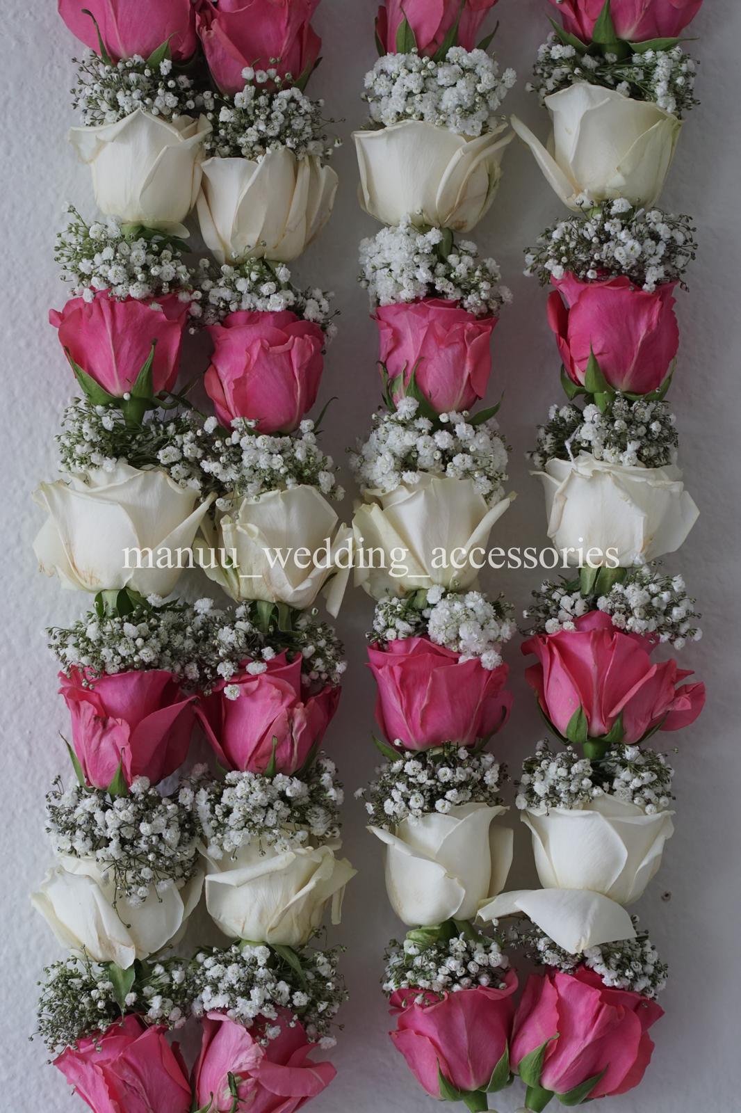 Pink and white roses with baby's breath garland