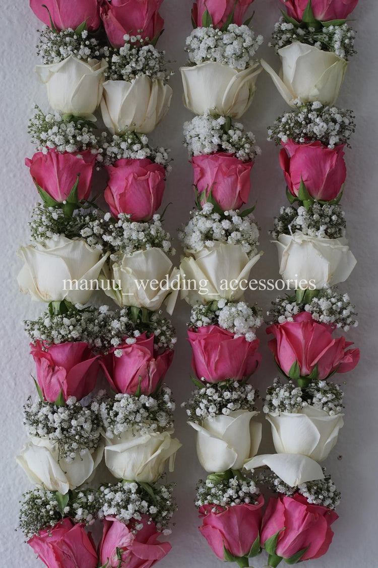 Pink and white roses with baby's breath garland