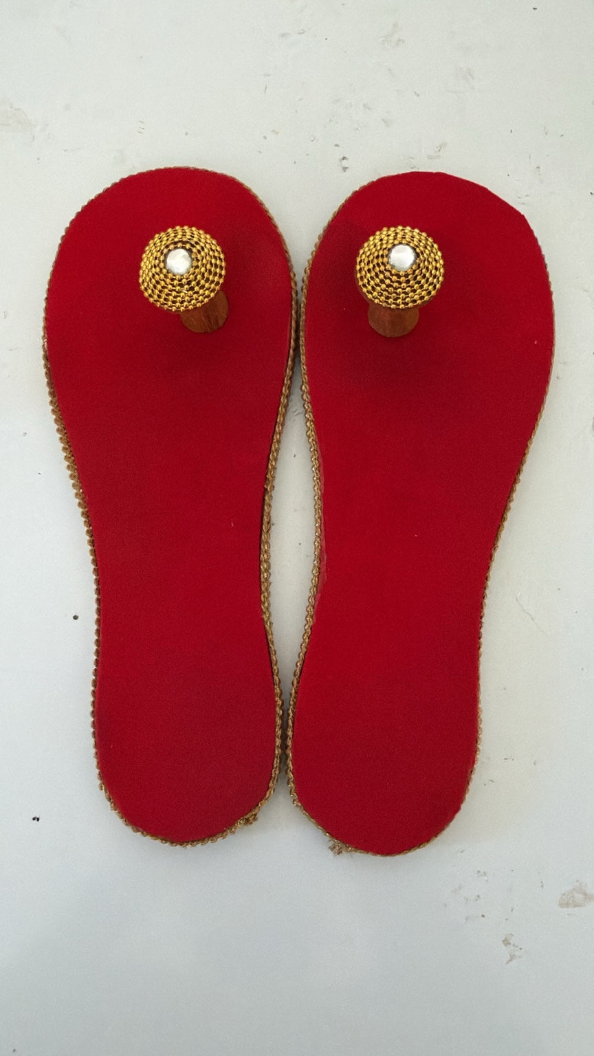 Red ceremonial Paduka pair with gold detailing