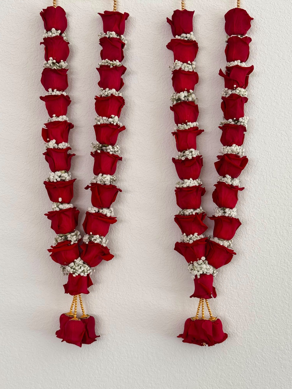 Red rose and baby's breath wedding garland – Houston